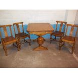 A 1930S DRAWLEAF OAK DINING SET WITH FOUR CHAIRS AND PINEAPPLE DESIGN