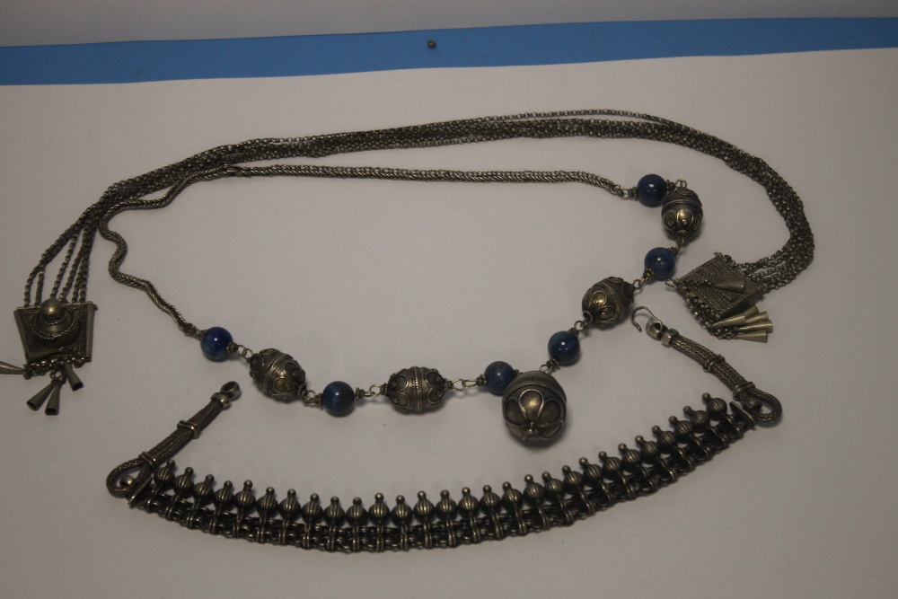 THREE EASTERN STYLE AND WHITE METAL NECKLACES