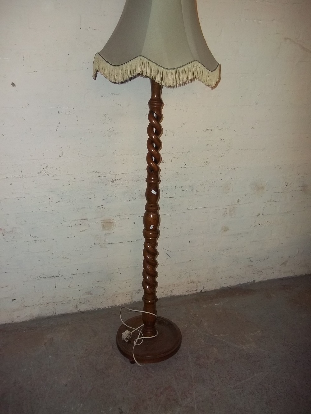 A CHUNKY OPEN TWIST FLOOR STANDING LAMP