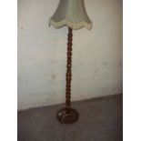 A CHUNKY OPEN TWIST FLOOR STANDING LAMP