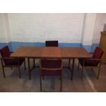 A RETRO VANSON TEAK EXTENDING DINING TABLE WITH FOUR CARVER CHAIRS