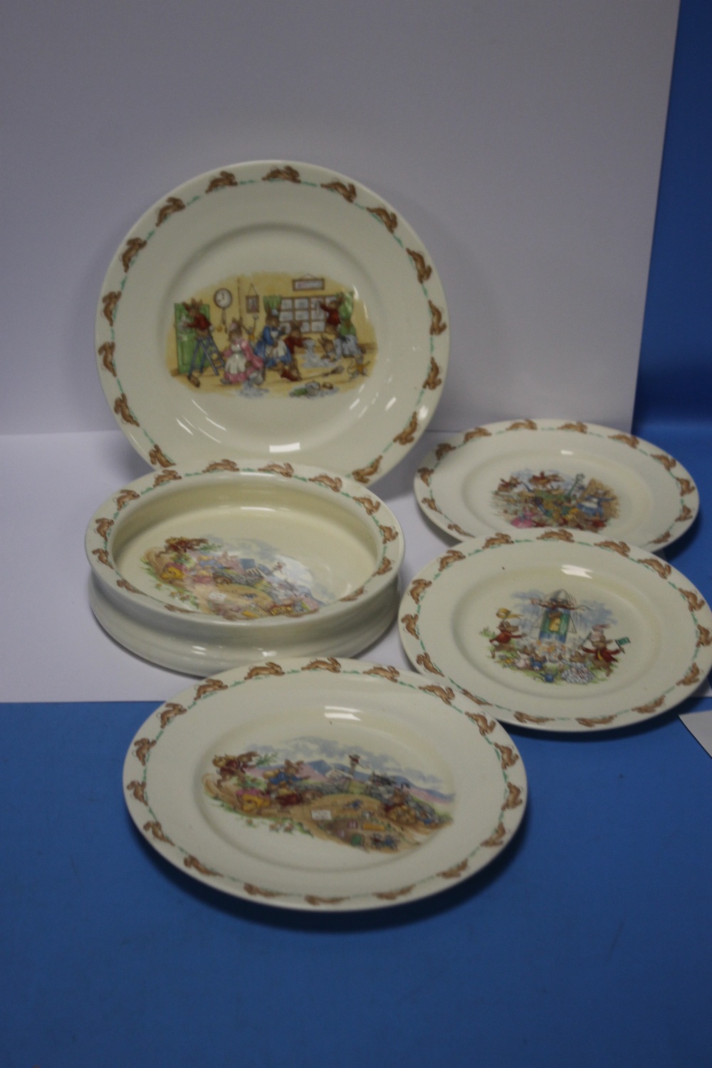 FOUR ROYAL DOULTON BUNNYKINS PLATES TOGETHER WITH A BUNNYKINS BOWL