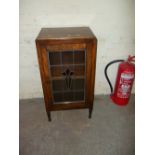 A VINTAGE OAK LEADED SIDE CABINET