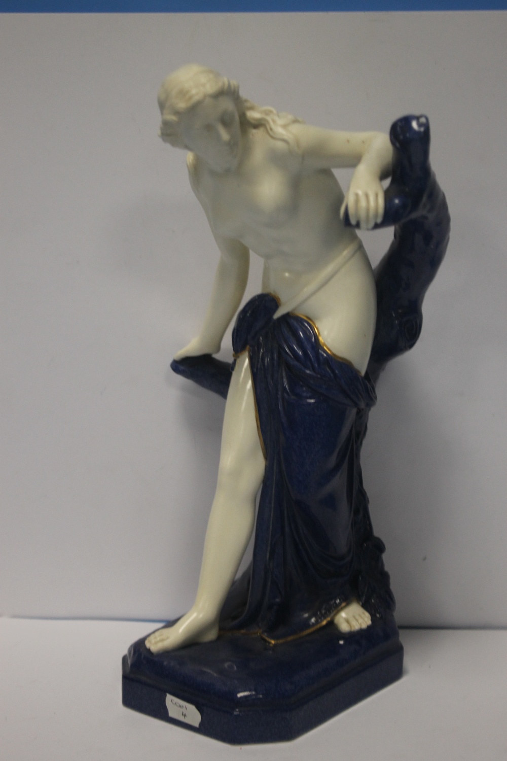 A ROYAL WORCESTER CROWN WARE CLASSICAL STYLE FIGURINE WITH BLUE BASE AND DETAIL