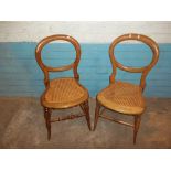 TWO ANTIQUE VICTORIAN BALLOON BACK BEDROOM CHAIRS WITH RATTAN SEATS