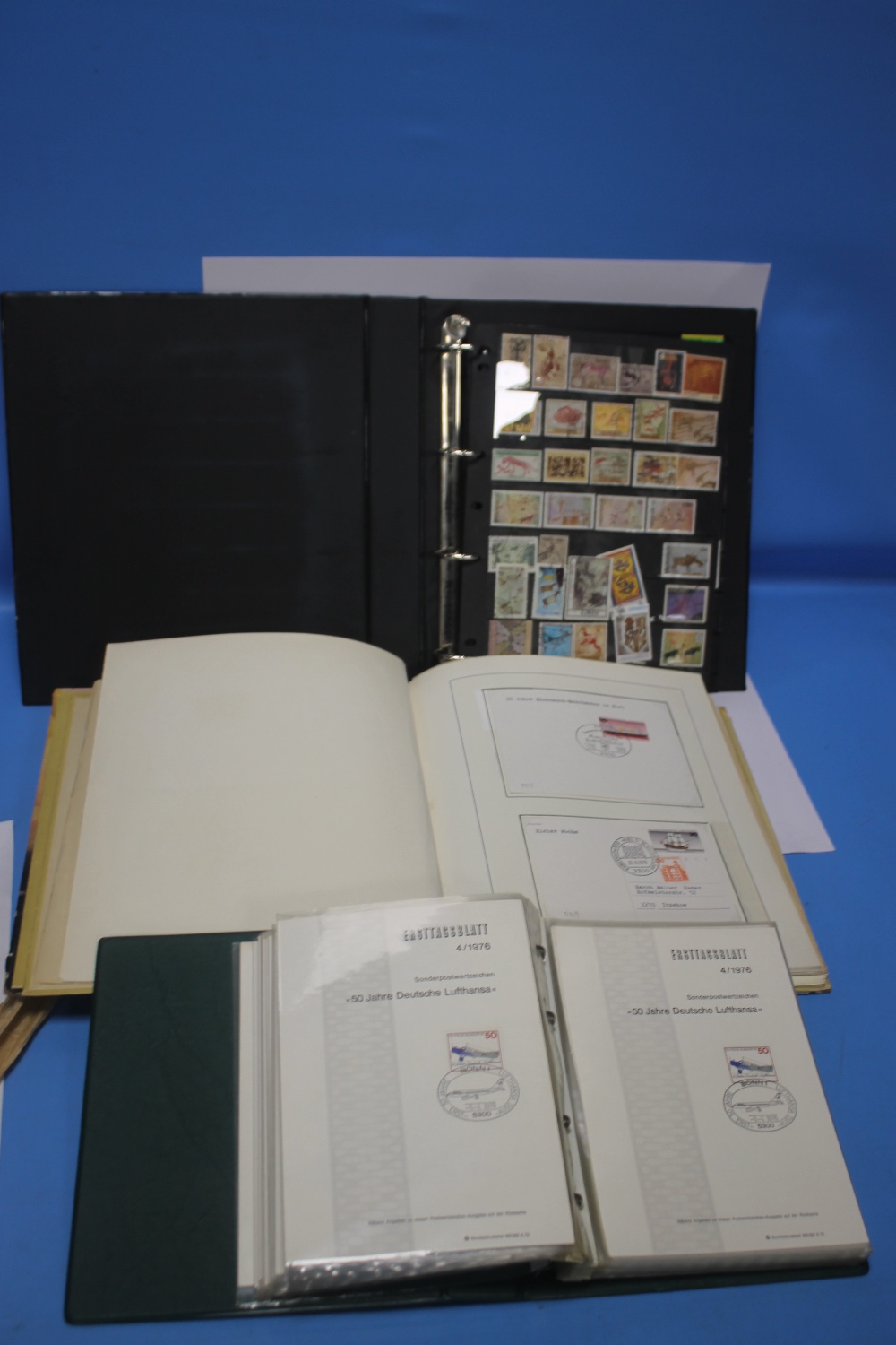 THREE STAMP ALBUMS TO INCLUDE BRITISH AND WORLD