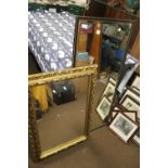 A GILT FRAMED MIRROR TOGETHER WITH ANOTHER, THE LARGEST 46 CM X 21.5 CM