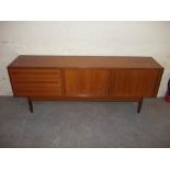 A RETRO TEAK SIDEBOARD WITH SLIDING DOORS