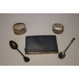 A SILVER CIGARETTE CASE, TWO SPOONS AND TWO NAPKIN RINGS