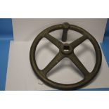 A BRASS/BRONZE FOUR SPOKE FLY WHEEL POSSIBLY FROM A WWI ARTILLERY PIECE D 30.5 cm