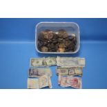 A TUB OF BRITISH AND FOREIGN COINS AND BANKNOTES