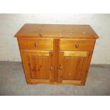 A TWO DRAWER, TWO DOOR SOLID PINE DRESSER SIDEBOARD