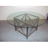 A LARGE CIRCULAR GLASS DINING TABLE WITH POLISHED STEEL LEG FRAME