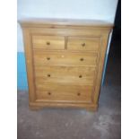 A LIGHT OAK FIVE DRAWER, TWO OVER THREE CHEST OF DRAWERS - MATCHES LOT 854