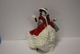 A ROYAL DOULTON FIGURINE 'VICTORIAN CHRISTMAS'