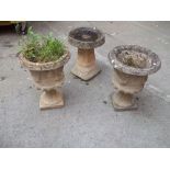 TWO CONCRETE GARDEN PLANTERS AND A BIRD BATH