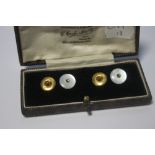TWO 9 CT GOLD STUDS AND ANOTHER PAIR IN MOTHER-OF-PEARL