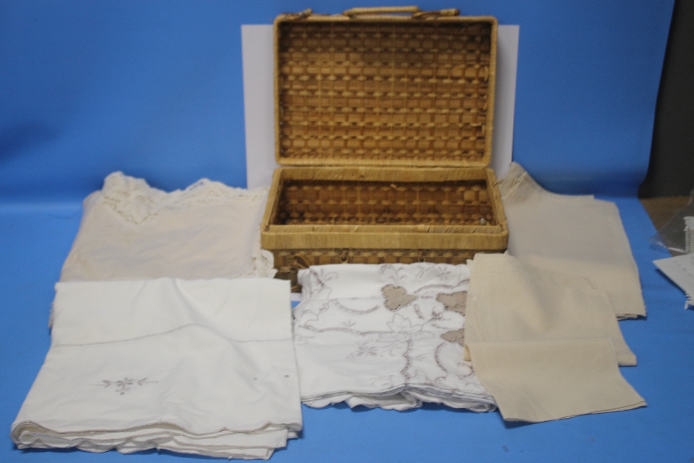 A BASKET OF VINTAGE TABLE LINEN