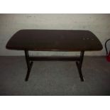 A DARK NARROW ERCOL DINING TABLE