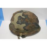 AN AMERICAN MI HELMET WITH LINER AND CAMO COVER, NO MAKER'S MARKS