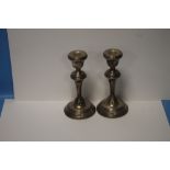 A PAIR OF HALLMARKED SILVER CANDLESTICKS