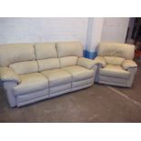 A CREAM LEATHER TWO PIECE SUITE COMPRISING THREE SEATER RECLINER SOFA AND STATIC CHAIR