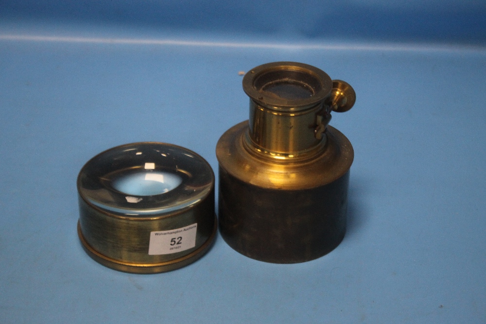 AN ANTIQUE BRASS MAGIC LANTERN LENS TOGETHER WITH ANOTHER (2)