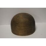 A WOODEN HAT MOULD