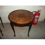 A BURR WALNUT SIDE TABLE WITH CABRIOLE STYLE LEGS