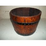 A HALF WHISKEY BARREL PLANTER