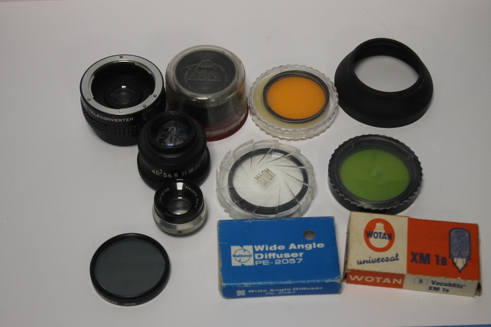 A QUANTITY OF CAMERA LENSES AND ACCESORIES