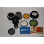 A QUANTITY OF CAMERA LENSES AND ACCESORIES