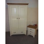 A MODERN OAK DOUBLE WARDROBE AND MATCHING THREE DRAWER BEDSIDE CHEST