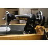 A CASED HARRISON SEWING MACHINE