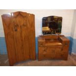 A 1950S TWO PIECE BEDROOM SUITE COMPRISING A WARDROBE AND A DRESSING TABLE