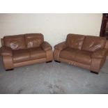 A TWO PIECE LEATHER SUITE COMPRISING TWO, TWO SEATER SOFAS