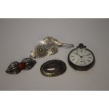 A SILVER OPEN FACED POCKET WATCH AND THREE WHITE METAL BROOCHES