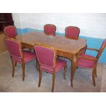 A LARGE WALNUT INLAID REPRODUCTION HIGH GLOSSED EXTENDING DINING TABLE AND SIX CHAIRS, MATCHES