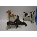 A COLLECTION OF FOUR CERAMIC ANIMALS TO INCLUDE A COW, A HORSE ETC SOME WITH STAMPS TO BASE MADE