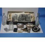 A COLLECTION OF ASSORTED PHOTOGRAPHS, THREE GLASS BOTTLES, TWO WHITE METAL CIGARETTE LIGHTERS ETC