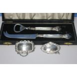 TWO HALLMARKED SILVER BOTTLE LABELS AND A WHITE METAL KNIFE AND BOTTLE OPENER SET WITH MOTHER OF