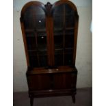 A VINTAGE OAK DISPLAY GLAZED BOOKCASE ON LEGS