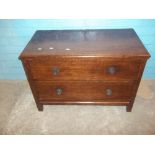 AN OAK LOW TWO DRAWER CHEST