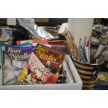A BOX OF ASSORTED KNITTING PATTERNS AND ACCESSORIES TOGETHER WITH A BUCKET OF KNITTING NEEDLES
