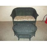 A TWO PIECE WICKER CONSERVATORY SUITE TO INCLUDE A TWO SEATER SOFA AND TABLE