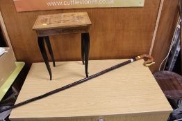 A LARGE WOODEN WALKING STICK WITH HAND PAINTED SNAKE SHAPED HANDLE TOGETHER WITH A MUSICAL JEWELLERY