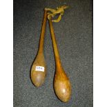 A PAIR OF VINTAGE WOODEN JUGGLING CLUBS