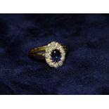 AN 18CT GOLD SAPPHIRE AND DIAMOND RING