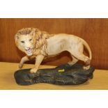 A BESWICK MATT FINISH LION ON A ROCK FIGURE