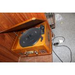 AN ITEK COMBINATION RECORD PLAYER AND RADIO